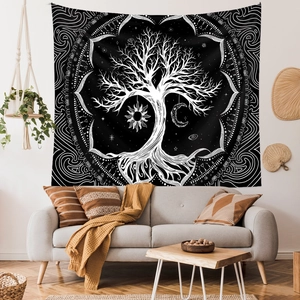 Detail of life tree tapestry with moon and sun motifs in a minimalist living room