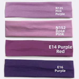 Close-up of four-piece elastic sports headbands in a range of stylish purple shades