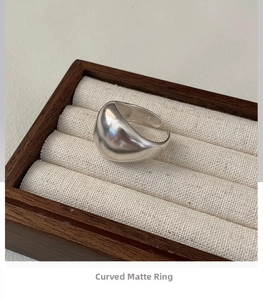 Macro detail of S925 sterling silver frosted ring band with hallmark engraving