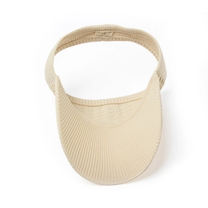 Close-up of the breathable knitted texture and wide brim of the beige sun visor hat