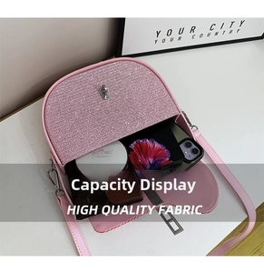 Pink sequin crossbody bag interior showing storage space for phone, wallet and makeup