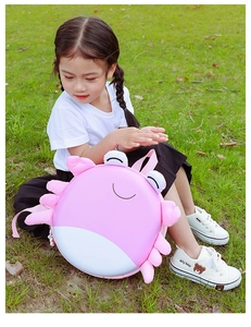 Pink cartoon crab eggshell backpack for kids with 3D plush claws on green grass