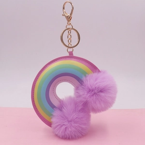 Rainbow PU leather keychain with golden ring and two large purple fluffy pom poms