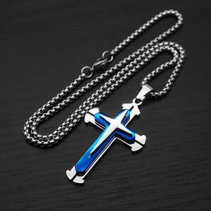 Close-up of double layer silver and blue cross pendant with stainless steel box chain