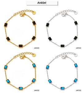 Detail view of gold and silver stainless steel anklets with black and blue zircon charms