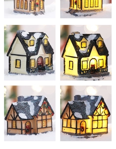 Detailed views of illuminated Christmas snow house with warm LED lights and glitter finish