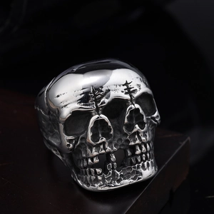Punk style stainless steel skull ring with vintage silver finish and triple face design