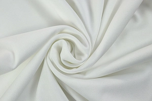 Close-up of white pleated knit fabric texture with elastic ribbed mesh detailing