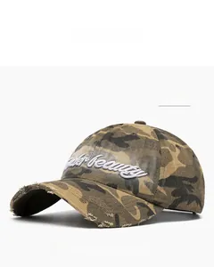 Detailed close-up of distressed brim and beauty embroidery on khaki camo baseball cap