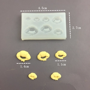 Macro detail of silicone mold for mini croissants showing precise 1.4cm product dimensions