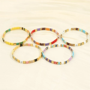 Detailed close-up of Bohemian Tila bead stretch bracelets with colorful enamel glaze