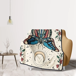 Detailed texture of flannel blanket with moon and butterfly print on a yellow sofa