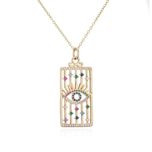 Detail of 18K gold-plated necklace with hollow eye pendant and colorful zircons