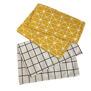 Linen placemats with geometric patterns and star grid motifs for dining table decor