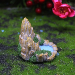 Miniature mountain landscape ornament with green moss and blue pond for garden decor