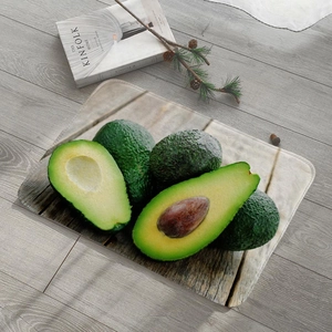 Detail of avocado flannel bath mat with secure anti-slip edging and realistic fruit print