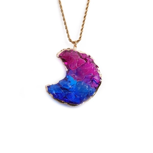 Blue-purple crystal moon pendant necklace with gold chain on white background