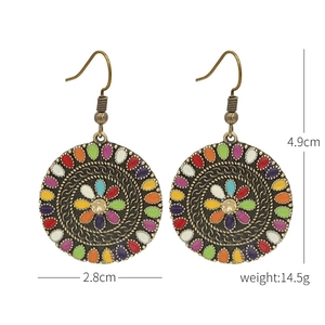 Detailed view of bohemian bronze earrings with dimensions 2.8cm width and 4.9cm height