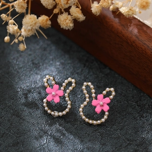 Cute rabbit stud earrings with white faux pearls and pink enamel flowers in gold finish