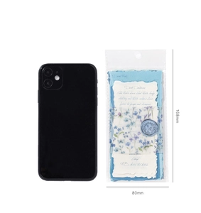 Size comparison of blue vintage collage paper 168mm x 80mm next to a mobile phone