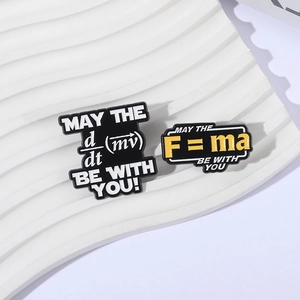 Physics formula enamel pins featuring Newton's second law and derivatives on white backdrop