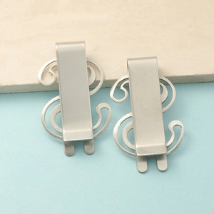 Set of two silver stainless steel money clips featuring a creative dollar sign shape design