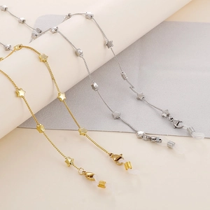 Star-decorated stainless steel glasses and face mask chain in gold and silver finish