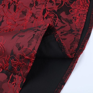 Detail of red and black floral jacquard fabric with high-quality lining and hem stitching