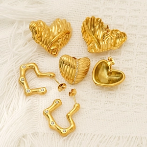 Golden titanium steel heart earring set with textured finish and zircon accents