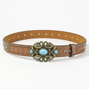 Close-up of vintage brown leather belt with bronze rivets and turquoise stones