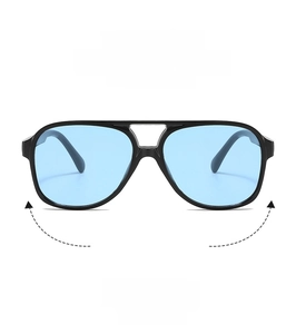 Detail view of vintage double-bridge sunglasses with black frames and blue lenses