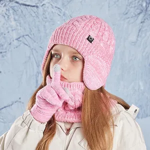 Pink kids winter knit set with pom-pom hat, scarf and gloves in thick cable knit style