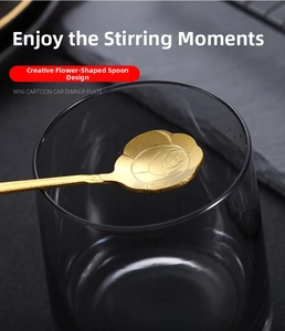 Macro shot of gold-plated stainless steel spoon with creative rose petal head design