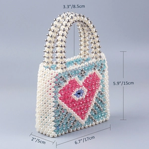 Handmade beaded bag dimensions showing 17cm length and 15cm height with pink heart pattern