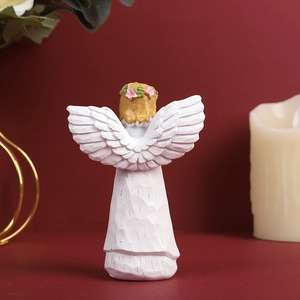 White resin angel figurine with golden hair and floral wreath on a red backdrop