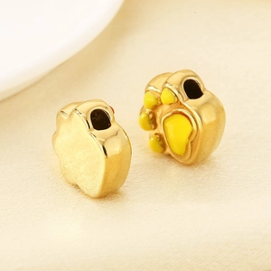 Golden stainless steel cat paw beads with yellow enamel details for charm bracelets