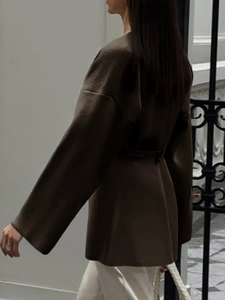 Deep brown long knit cardigan featuring wide sleeves and waist tie belt detail