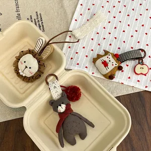 Handmade plush animal charms with lion, bear and hedgehog designs for bags and keys