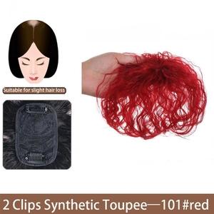 Detailed view of red synthetic hairpiece with clips and inner mesh structure for thinning hair.