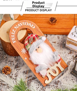 Detail of wooden Christmas door hanger with plush Santa and Feliz Navidad text
