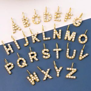Set of 26 gold-plated alphabet pendants with white faux pearls for DIY jewelry