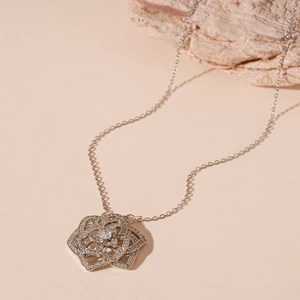Elegant silver rose pendant necklace featuring micro-set cubic zirconia and a dainty chain