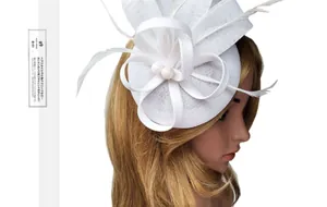 Detail of white fascinator featuring layered mesh flower and elegant feathers for weddings