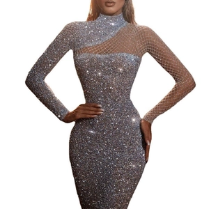 Detailed view of silver sequin dress with mesh patchwork and sheer diagonal inserts