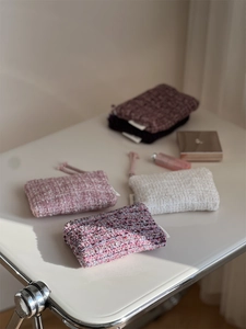 Macro shot of colorful tweed fabric textures on these small rectangle storage pouches