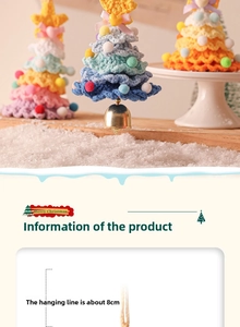 Detail of knitted Christmas tree hanging ornament with golden bells and soft colorful pom-poms