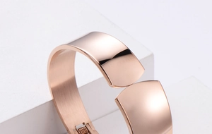 Macro shot of rose gold stainless steel bracelet with spring hinge and mirror finish