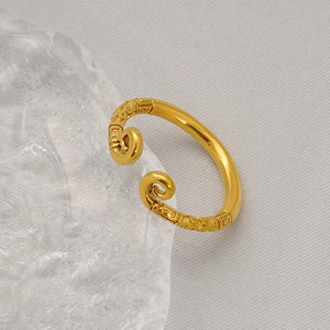 Detailed close-up of golden Sun Wukong open ring featuring intricate relief cloud patterns