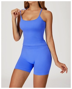 Detailed texture of royal blue ribbed yoga set featuring a strappy top and high waist shorts