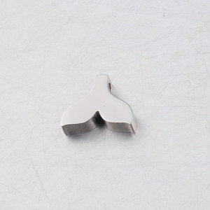 Macro detail of silver mirror-polished titanium steel mermaid tail pendant DIY charm